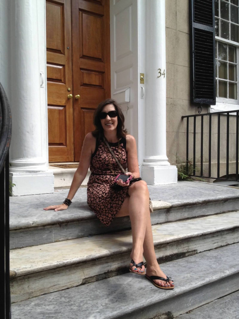 Sitting on steps of charming Charleston home