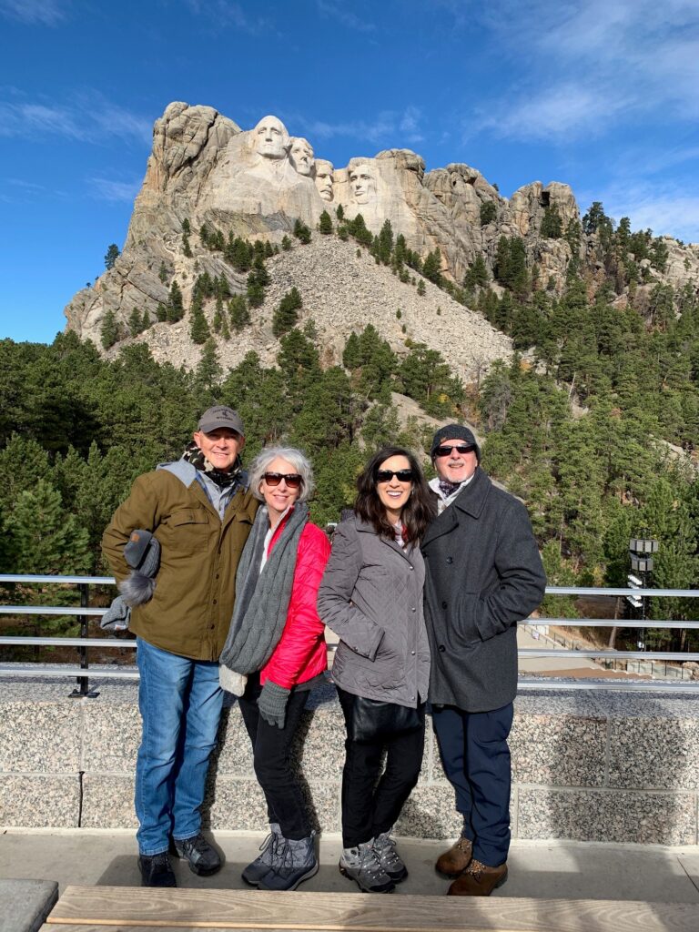 Standing in front of Mt Rushmore with friends