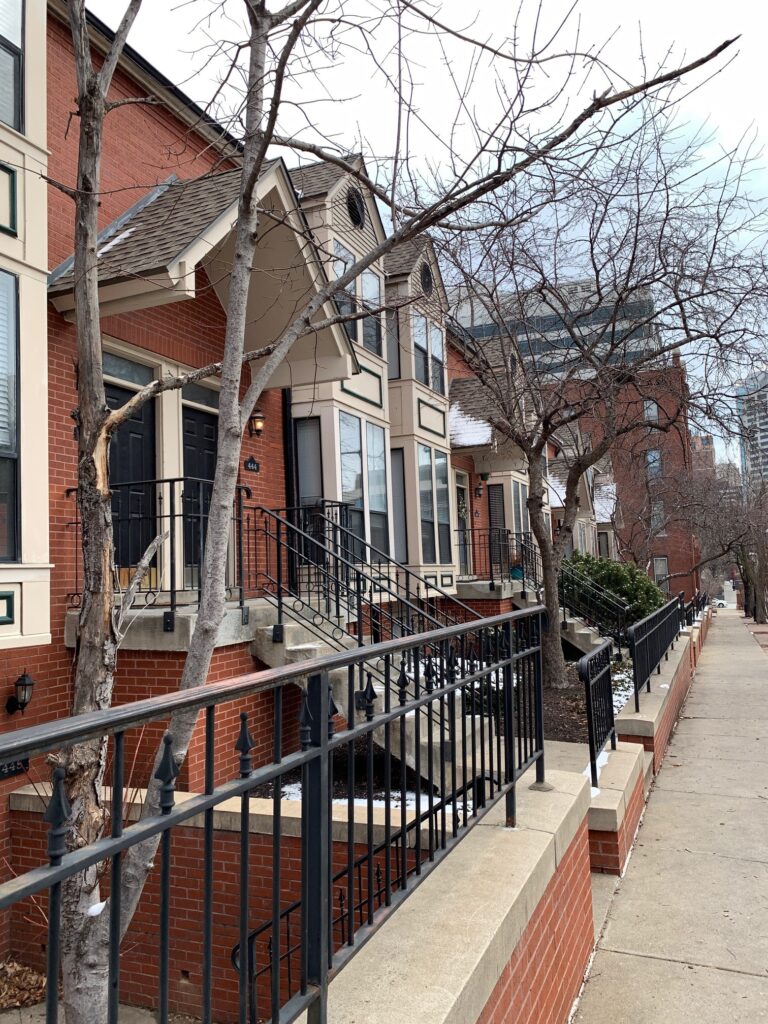 Brownstone-looking-homes-lined-up-with-stoops-across-from-Cathedral.