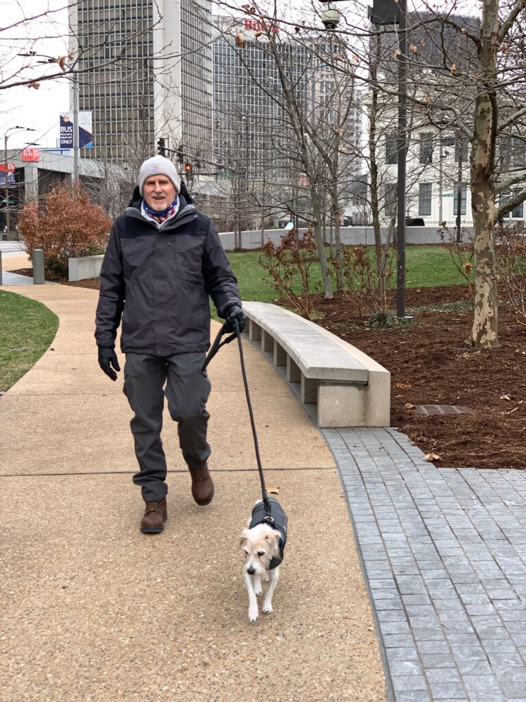 Bud walking Trit on grounds at Gateway Arch NP