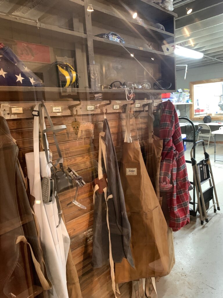 Aprons and flannel shirt hanging in Ben's Workshop Laurel MS